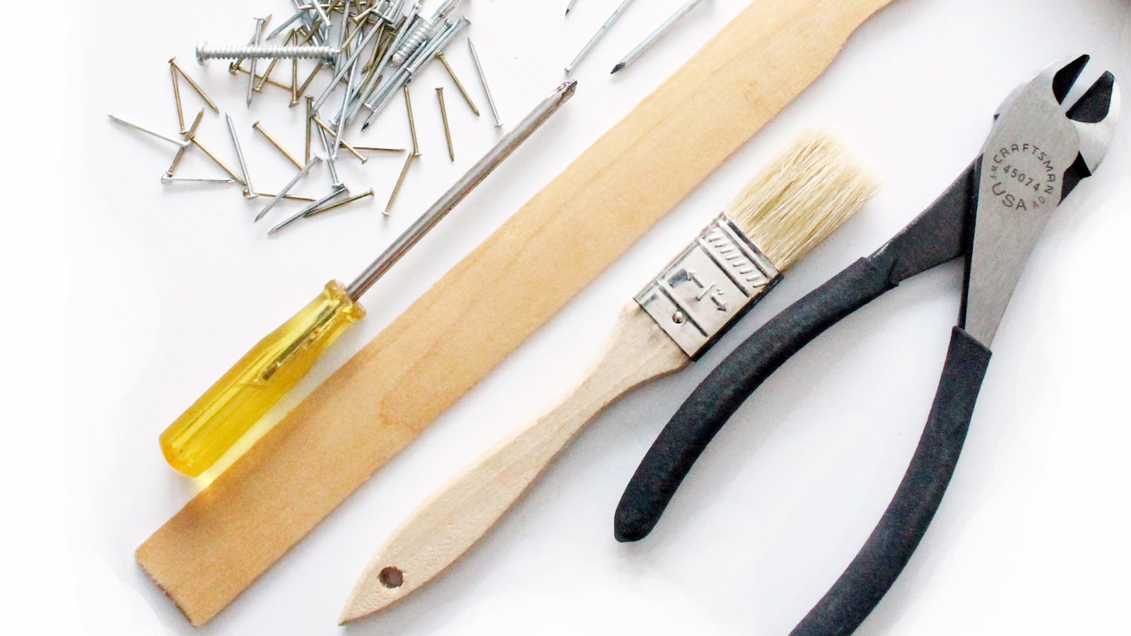 Hand tools neatly organized on a workshop wall.
